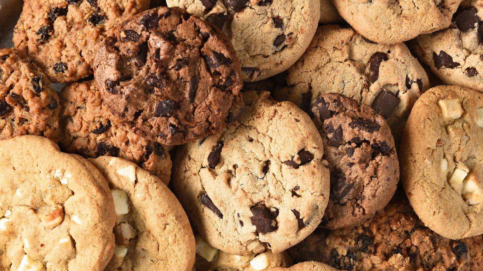 Top view of a pile of chocolate chip cookies in different varieties